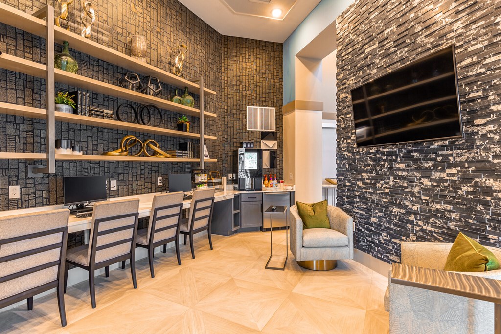 a living room with a dining room table and chairs and a kitchen