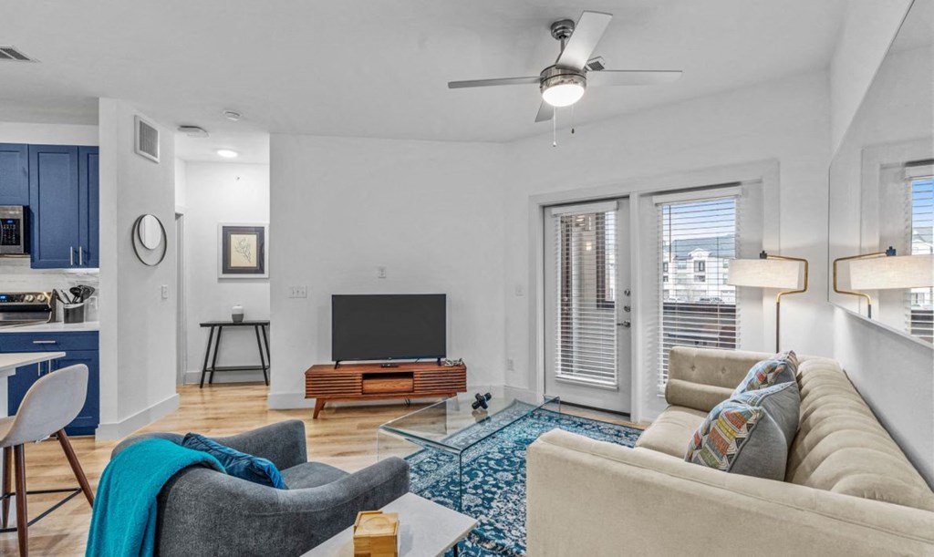 a living room with a couch and a tv