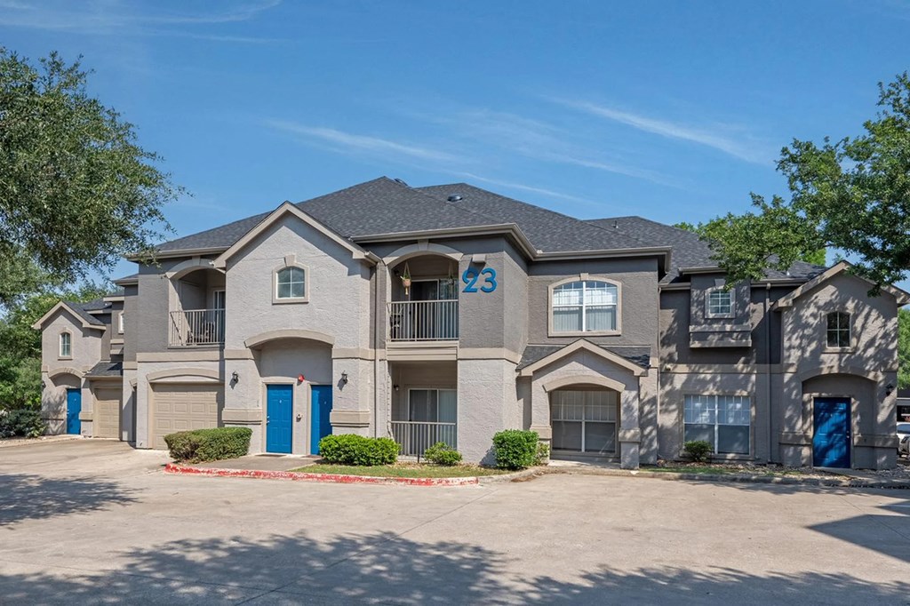 A large, modern house with the number 23 on the front.