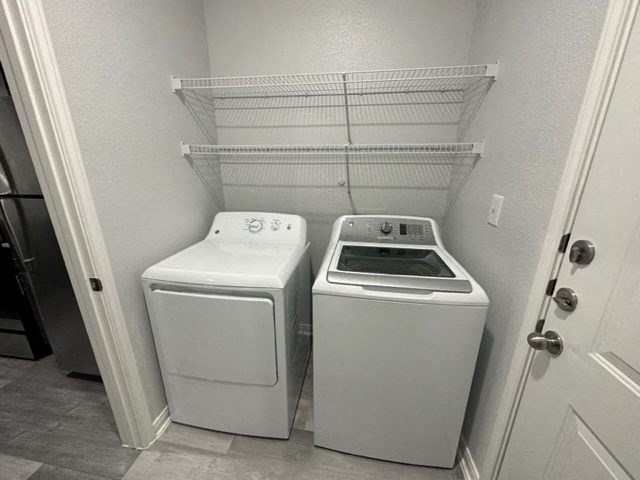 a white washer and dryer in a laundry room