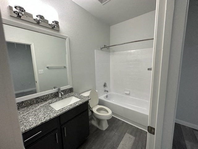 a bathroom with a sink toilet and a bath tub