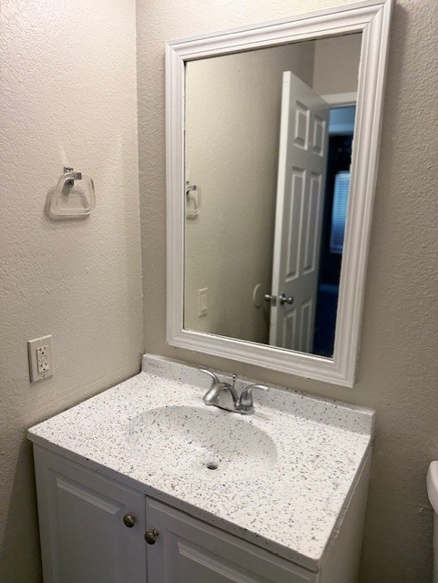 A bathroom sink with a mirror above it.