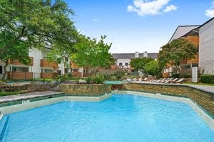 a large pool of water next to a building