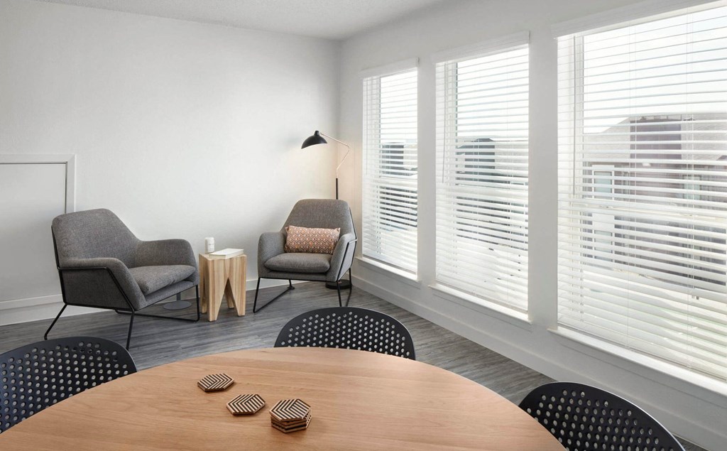 a meeting room with chairs and a table