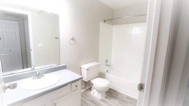 a bathroom with a toilet and a sink and a mirror