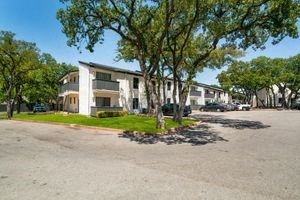 a building with a parking lot in front of it