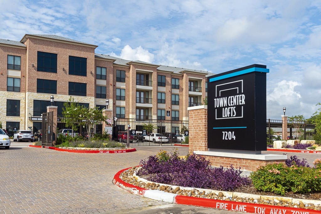 a large building with a sign for town center lofts