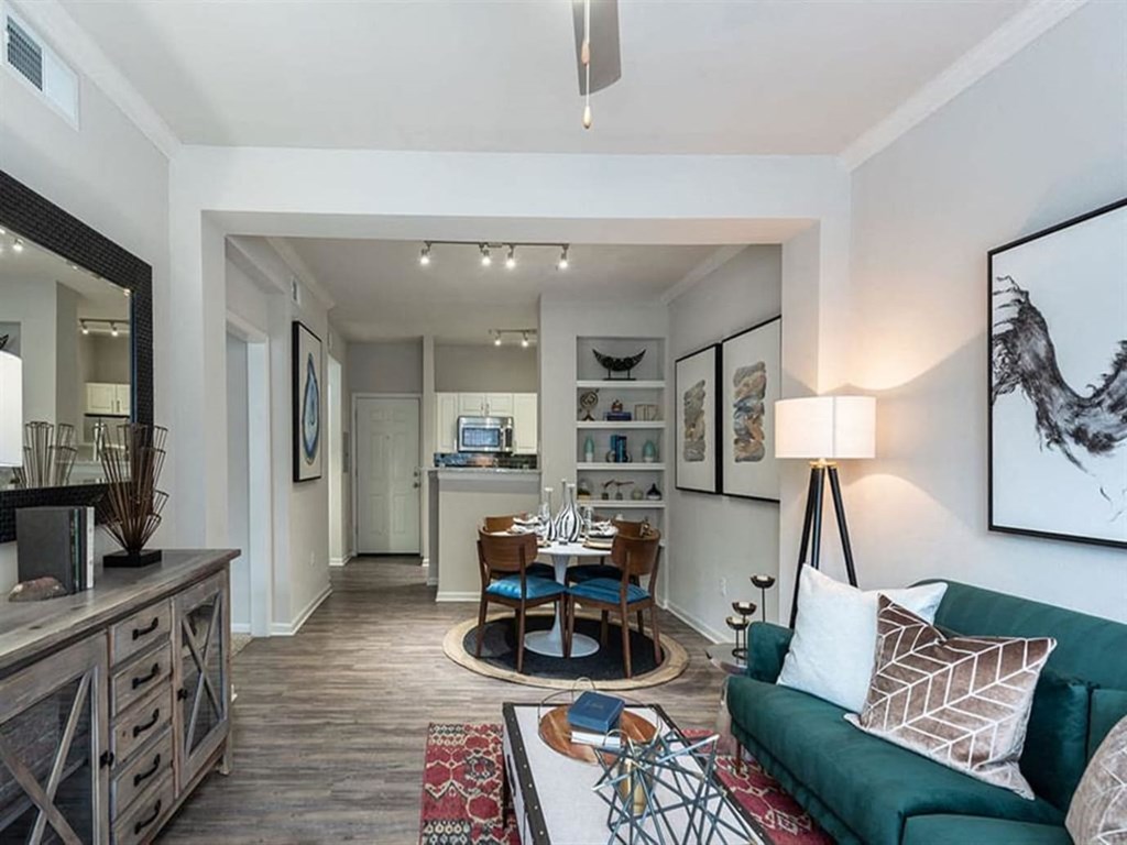 a living room with a couch and a dining room table