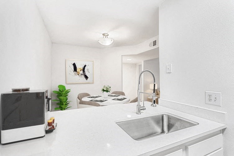 a kitchen with a sink and a microwave