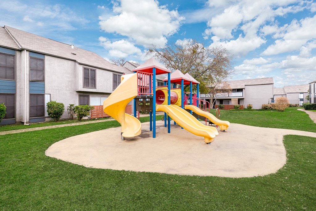 a playground at the whispering winds apartments in pearland, tx
