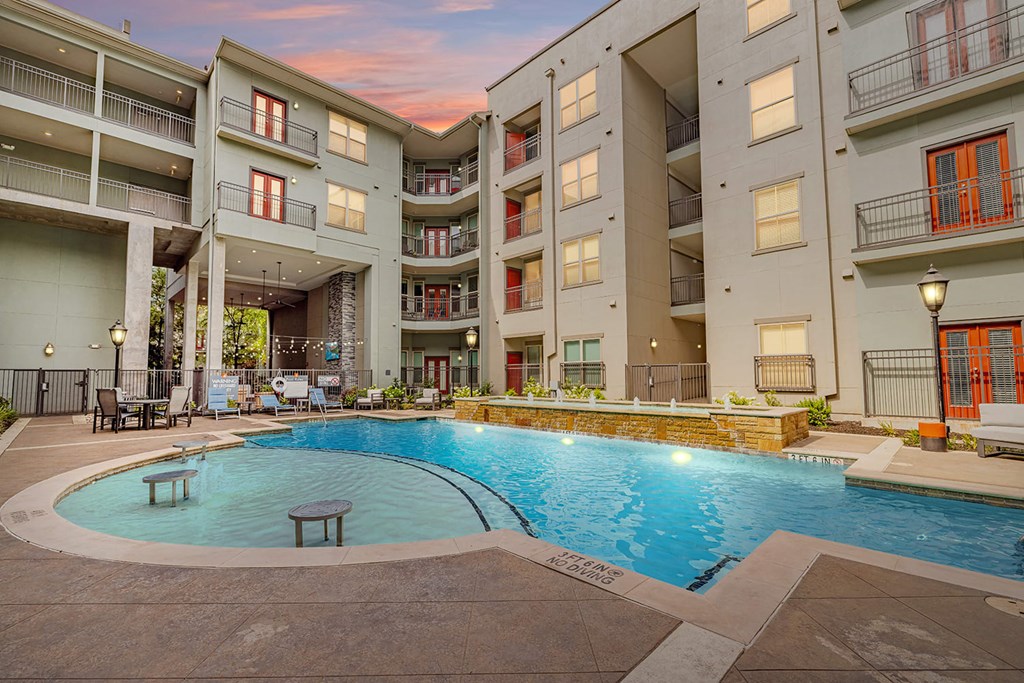 a swimming pool in the middle of an apartment building