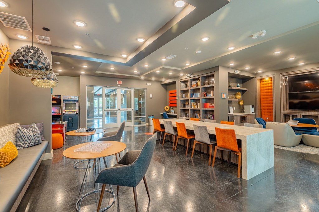 Clubhouse lounge area with seating and desk/chairs