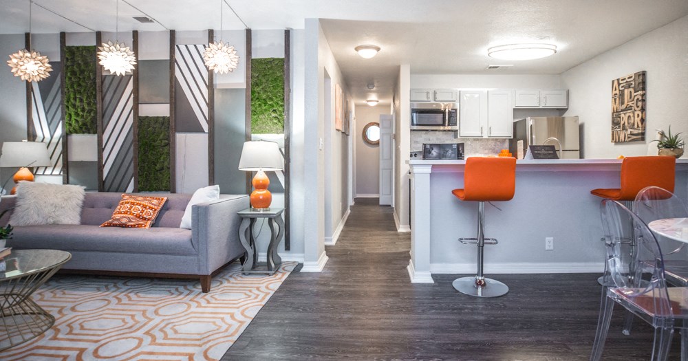 a living room and kitchen area in a 555 waverly unit