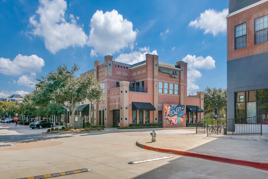 a brick building with a mural on the side of it