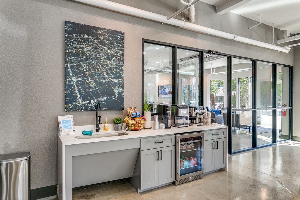 an office with a counter and glass doors