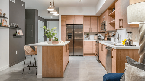 a kitchen with wooden cabinets and stainless steel appliances