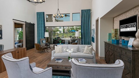 A living room with a grey sofa and a coffee table.