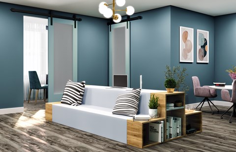 A modern living room with a white sofa and a wooden coffee table.