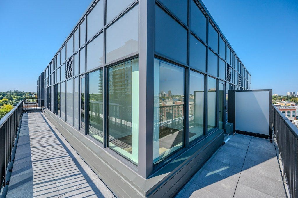 a building with large glass windows and a balcony