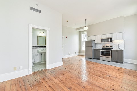 A kitchen with a stove top oven and microwave.