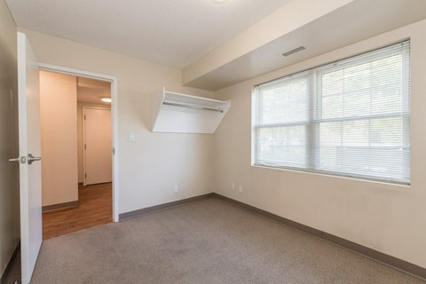 A room with a window and a door.