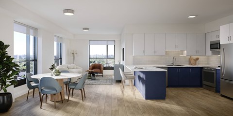 A modern kitchen with a dining table and chairs.