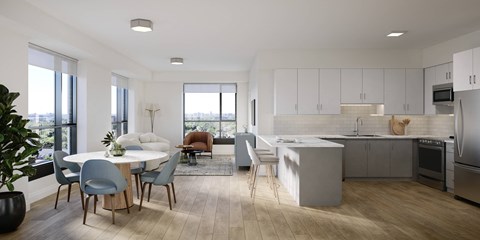 A modern kitchen with a dining table and chairs.