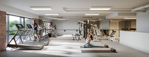 A woman is stretching on a mat in a gym with treadmills and other exercise equipment.