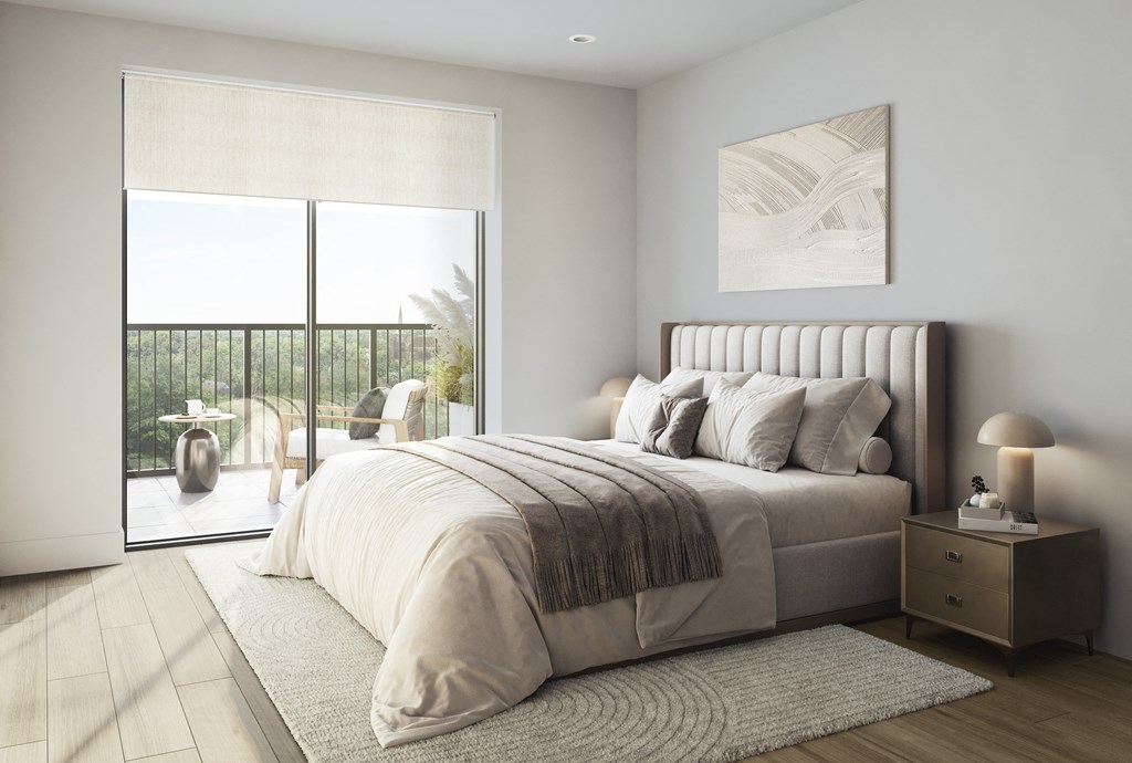 an image of a bedroom with a bed and a balcony