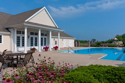 Heated outdoor Olympic swimming pool with lavish sundeck at Prairie Point apartments.