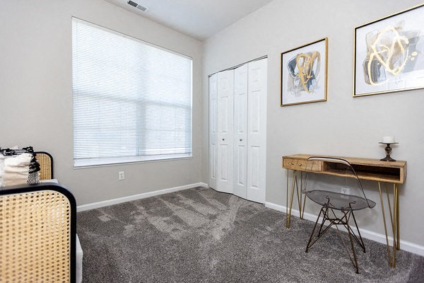 A room with a desk and chair in it.