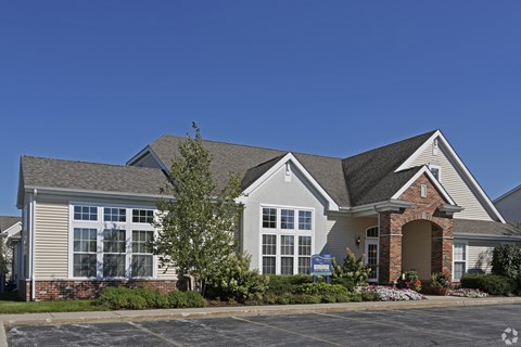 A large house with a brick pillar entrance.