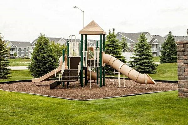 Resident playground with jungle gym and slides at Merrillville, IL apartments