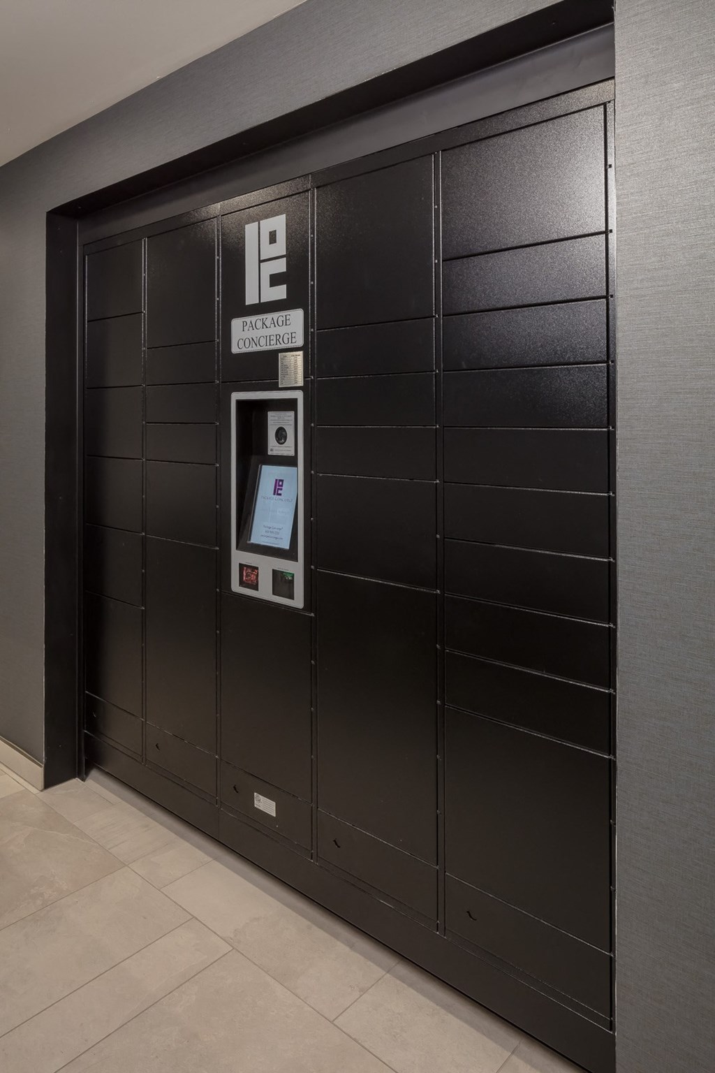 a large black metal door with a digital display on the side of it