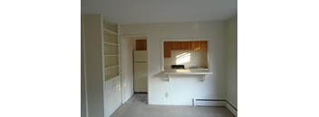 a view of a kitchen with a sink and a refrigerator