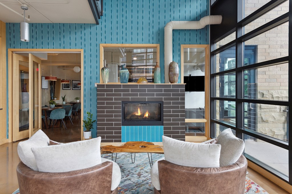 a living room with blue walls and a fireplace