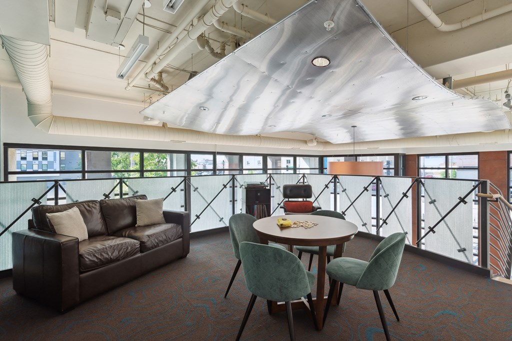 a room filled with furniture and a large window