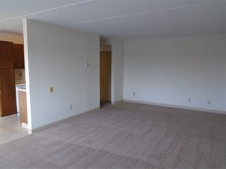 Living area with access to kitchen at John Snell Apartments - Photo Gallery 3