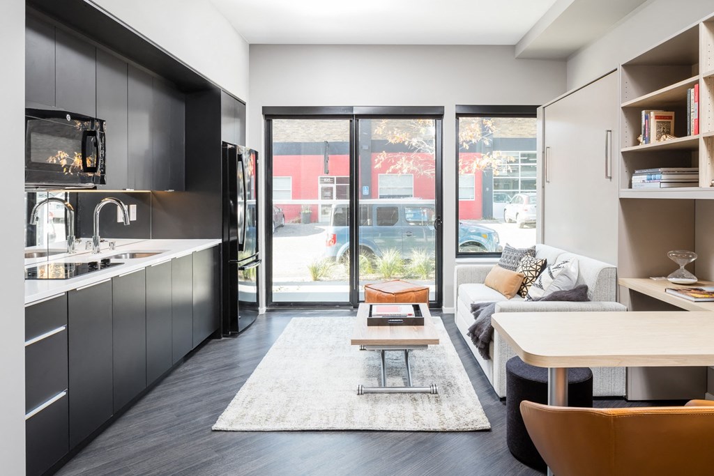 a living room with a white couch and a table