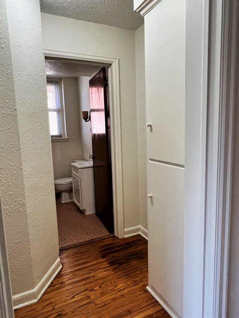 a small bathroom with a toilet and a window