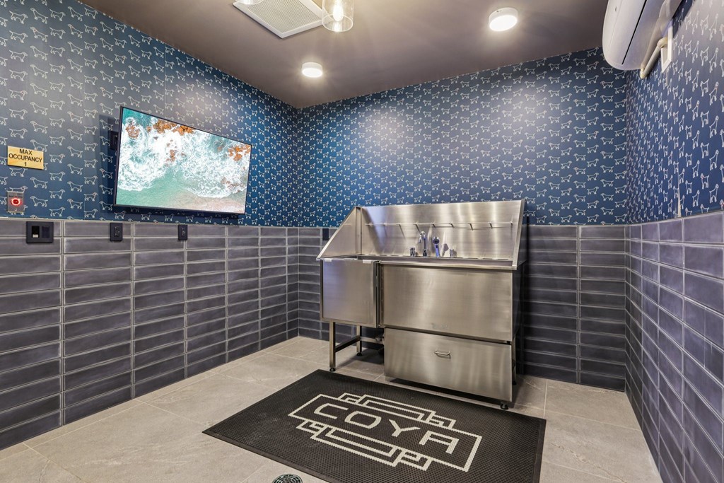 A room with a Coca Cola logo on the floor mat.