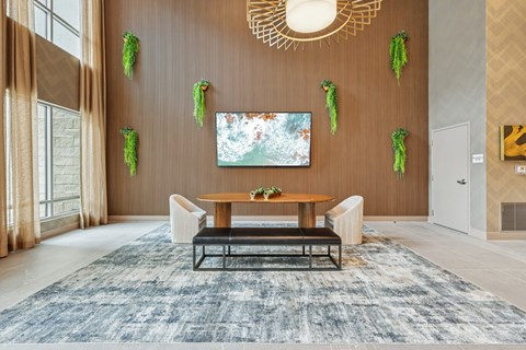 A room with a brown wall and a painting hanging on it.