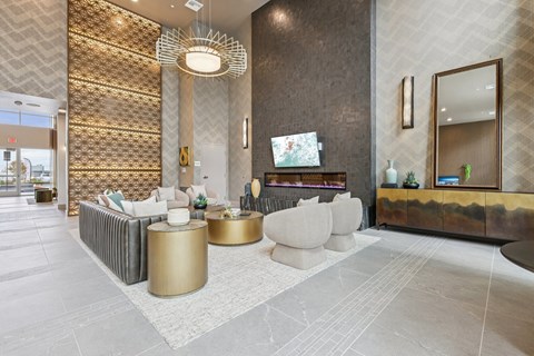 A modern living room with a gold and white color scheme.