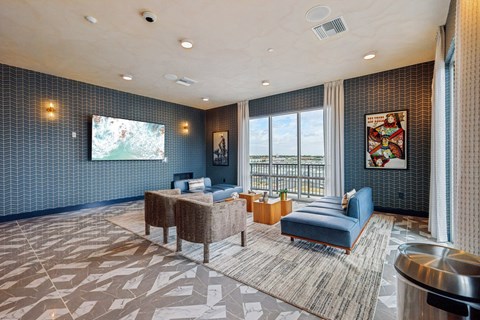 A room with a patterned floor and a large window.
