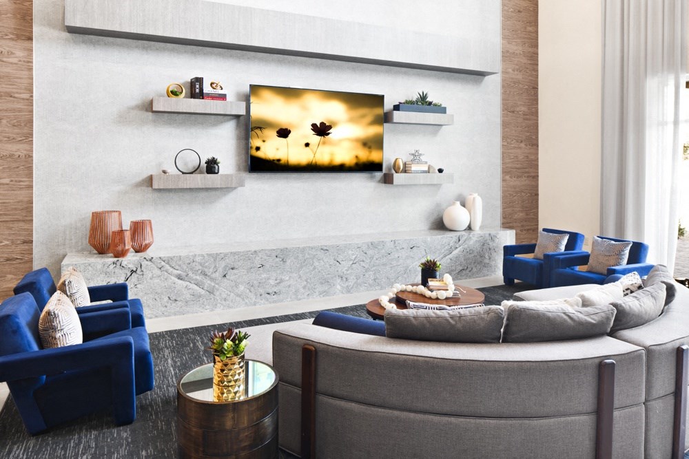 a living room with a couch and a table at Aura Vegas Apartments, Las Vegas