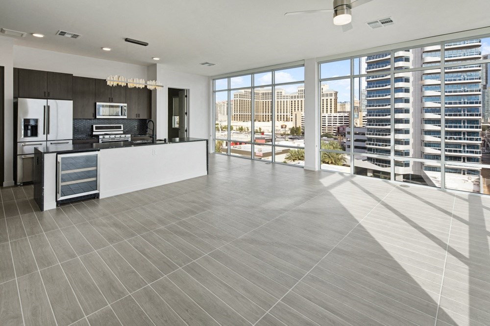 a living room with a view of a skyscraper at Aura Vegas Apartments, Las Vegas, NV