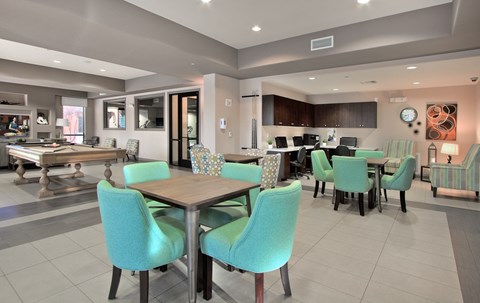 A modern dining room with a table set for six.