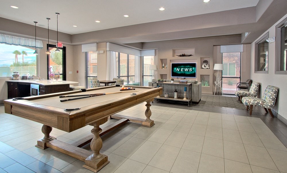 a view of the floor of a store with stacks of folded shirts on display