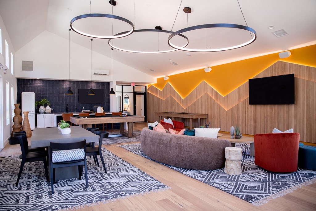 a living room with a couch and a dining table