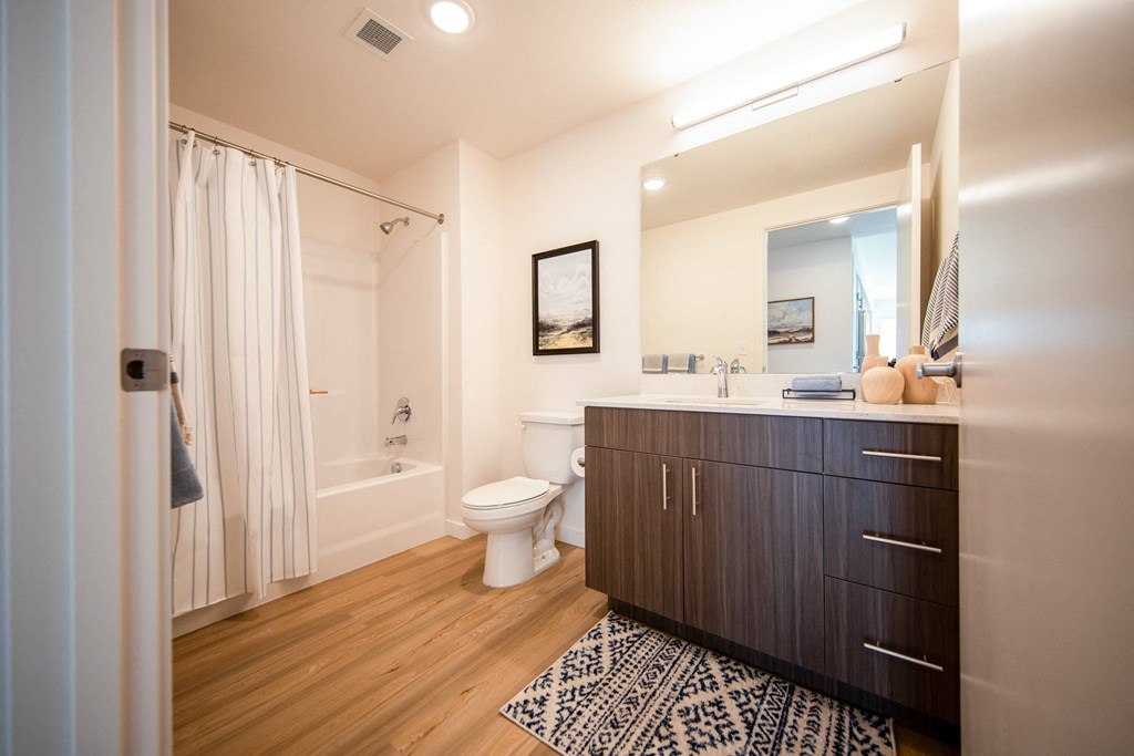 a bathroom with a wooden floor and a sink and a toiletat Scouter's Mountain, Oregon, 97086